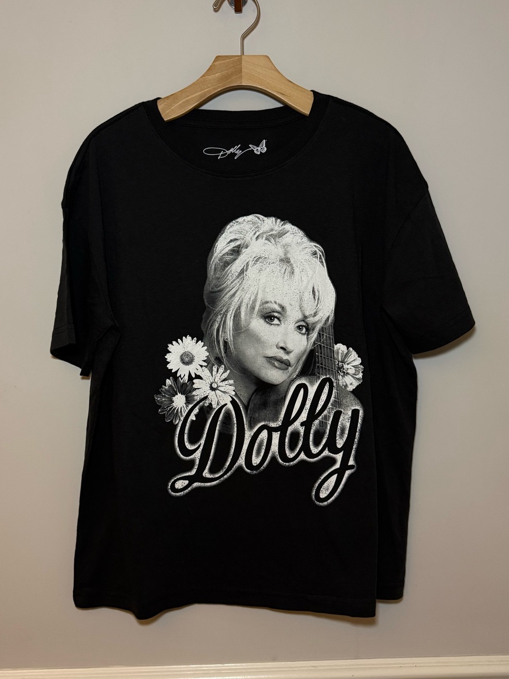 Dolly black graphic design with Dolly’s face and her name on front T shirt. S